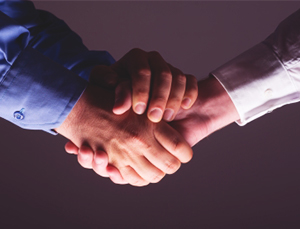outsourcing partner shaking hands