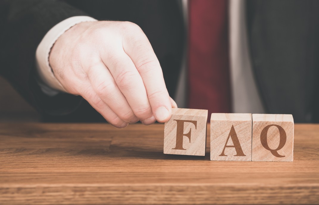 FAQ blocks arranged by hand to represent what is bpo and other frequently asked questions