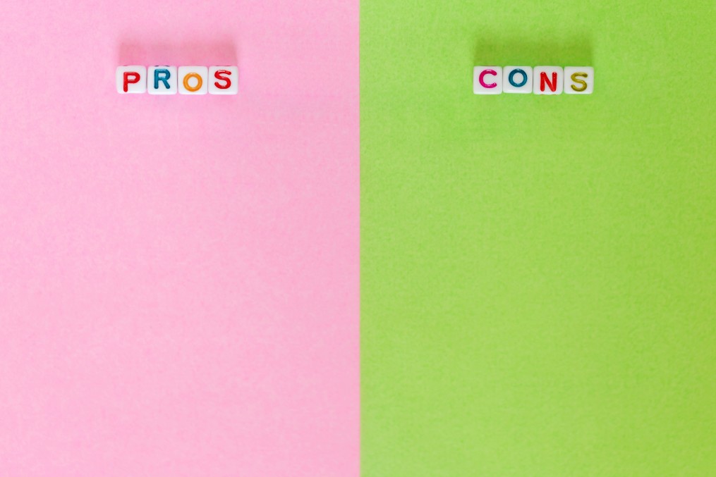Colorful image of pros and cons of outsourcing