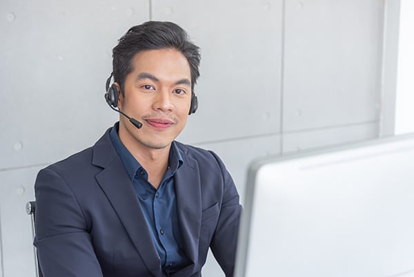 solving problems for customers employees wearing headphone