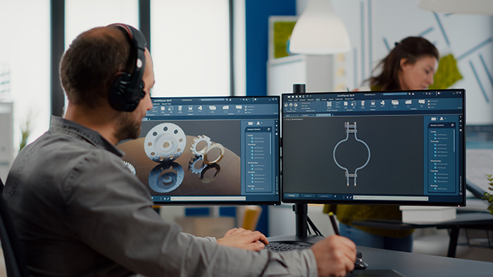 cad operator putting on headphones while working