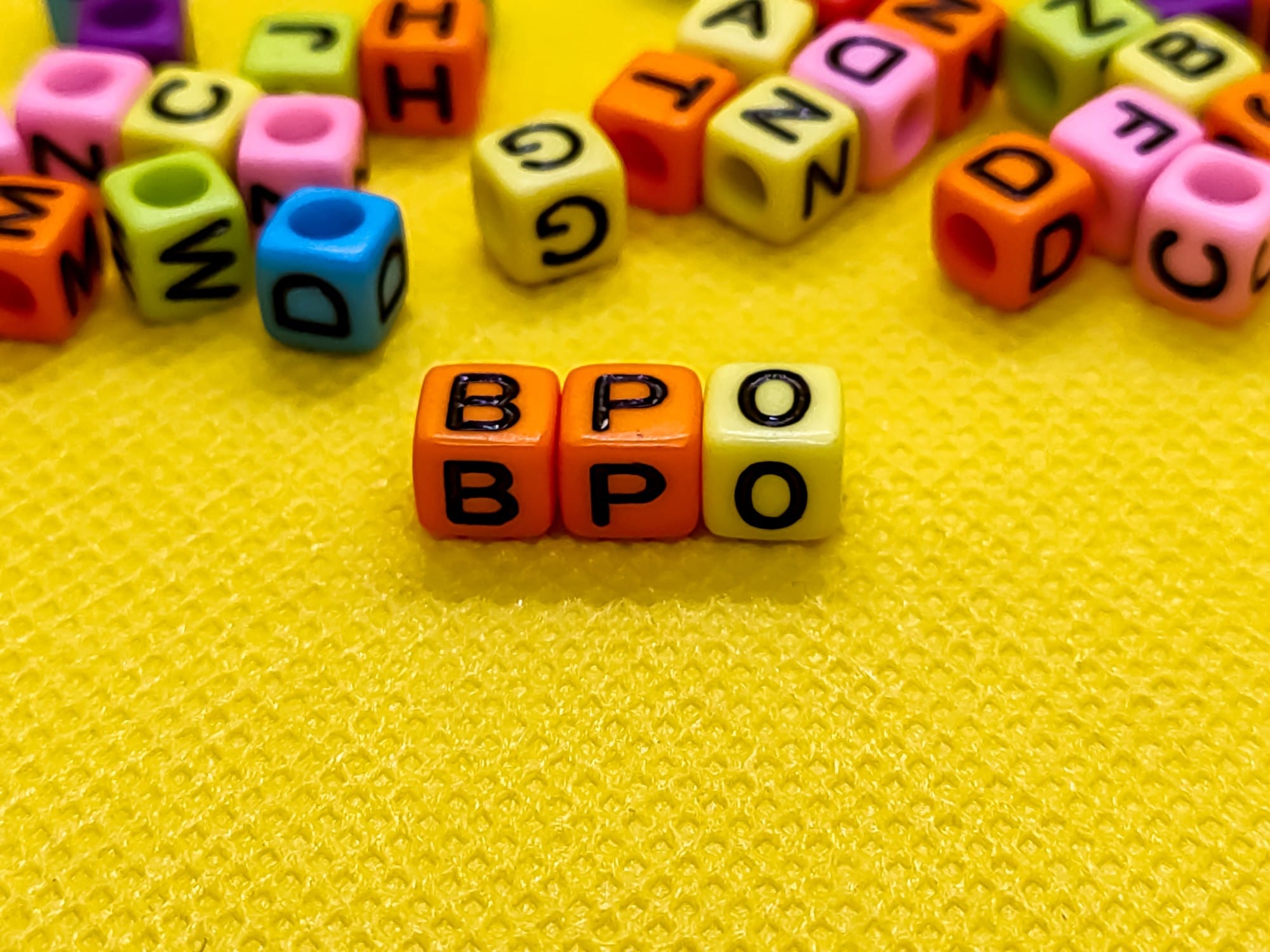 A dice of letters forming BPO