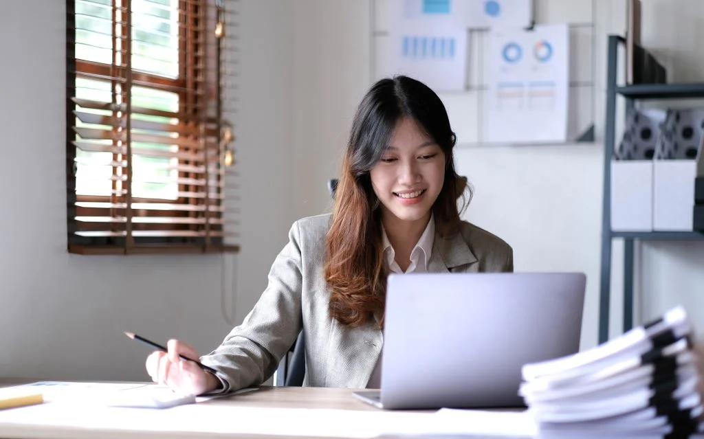 young asian businesswoman working on laptop