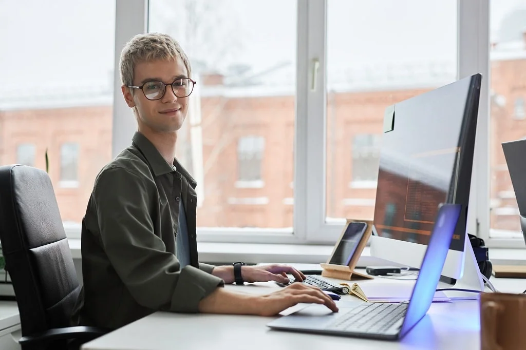 a programmer developing software on his computers