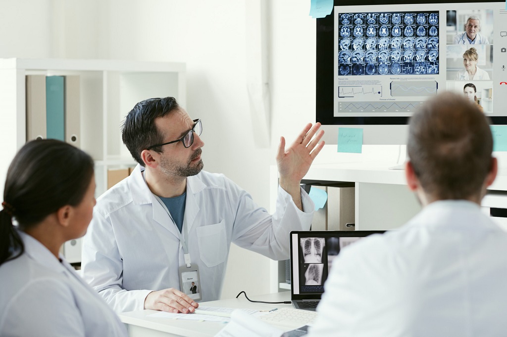 a group of doctors reviewing x-rays
