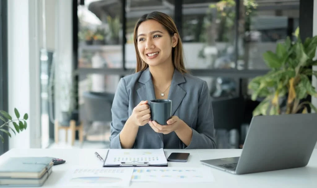 asian businesswoman smiling happily with a new mor 2023 08 05 04 47 15 utc 1024x606 1