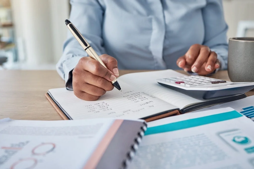 closeup photo of a an accountant delivering payroll outsourcing services