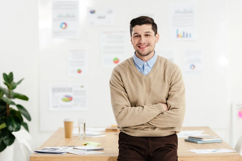 portrait of a smiling marketing manager with arms crossed