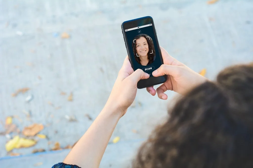 woman using facial recognition technology powered by data annotation tools