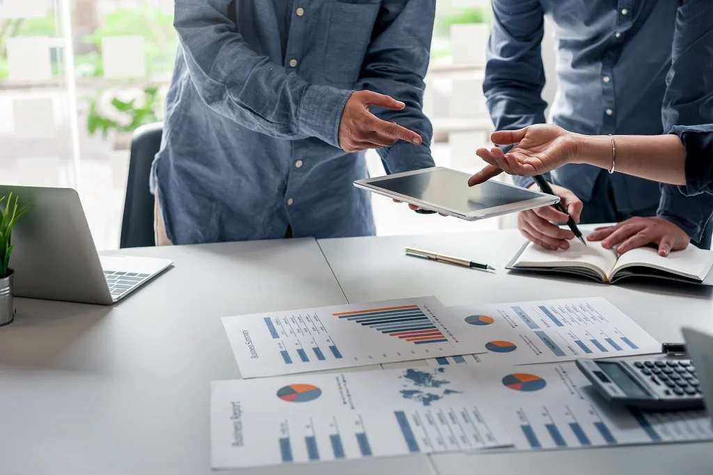 A closeup of an inside sales outsourcing team analyzing their marketing campaigns