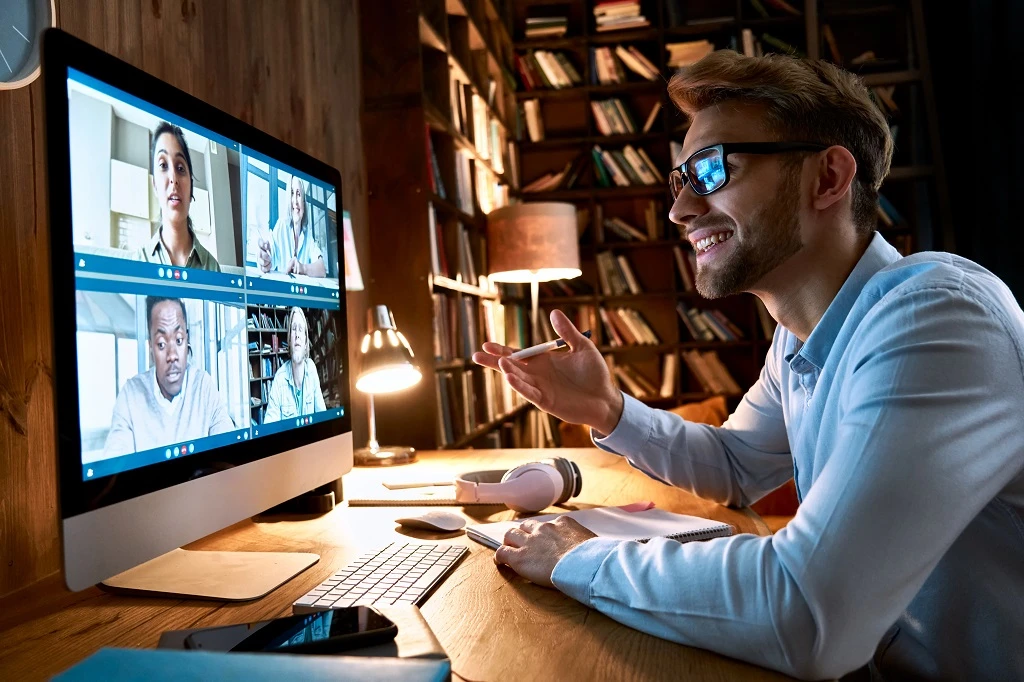 a businessman having a virtual meeting with his knowledge process outsourcing team