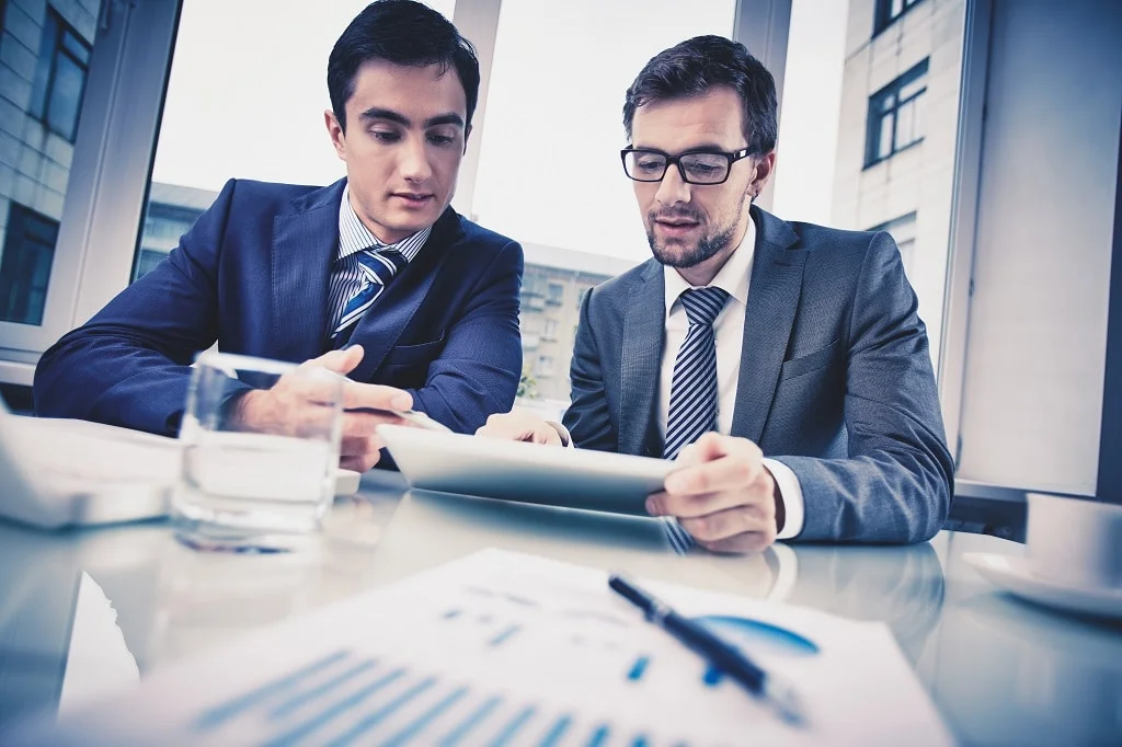 an appointment setter discussing service offerings with a client