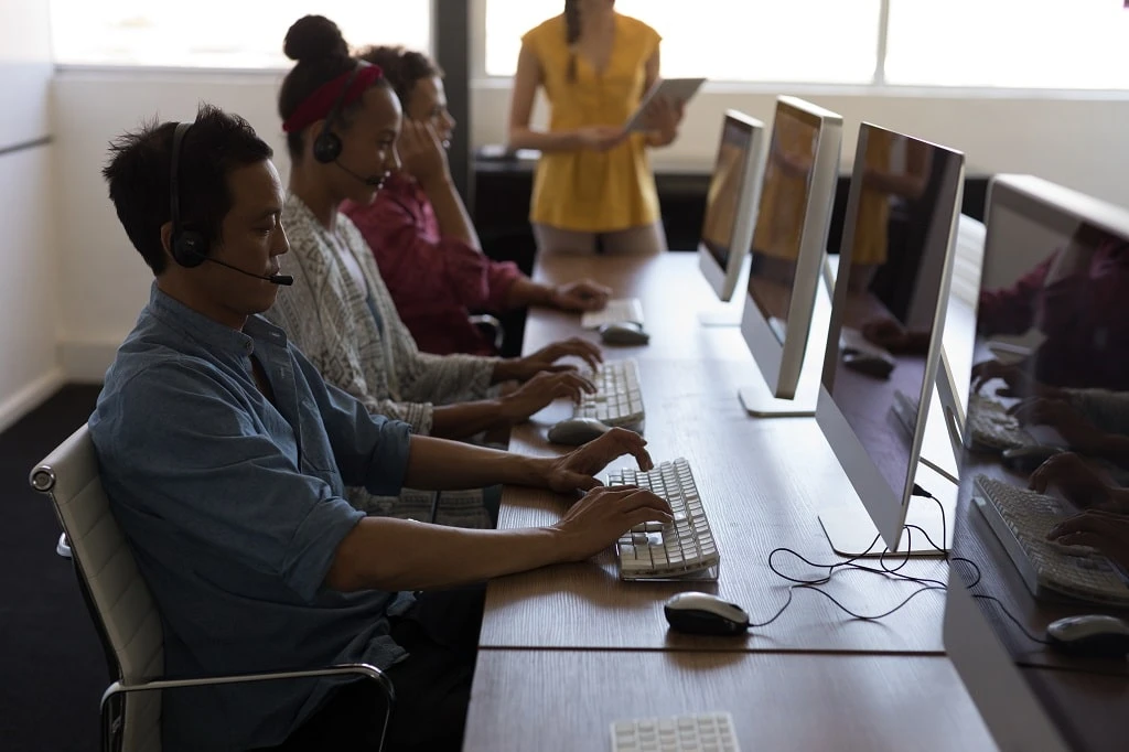 a filipino bpo team working in a modern office