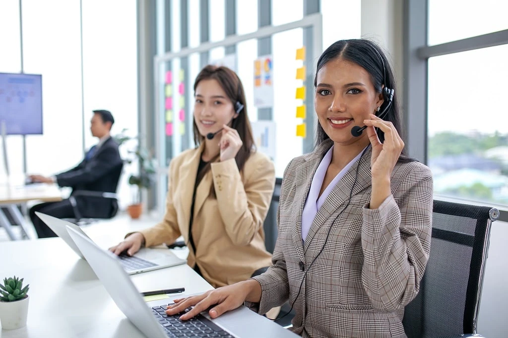 a filipino bpo team working together in a busy office environment