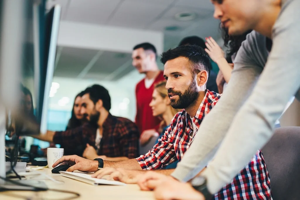 a team of web developers collaborating on projects in a dynamic workspace