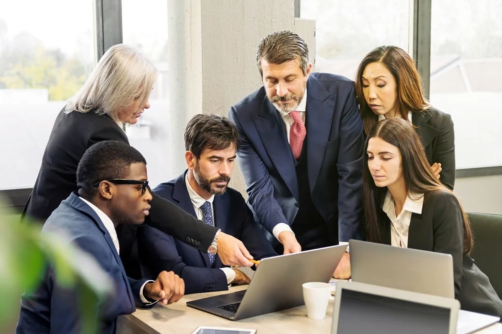 diverse colleagues analyzing data in the office