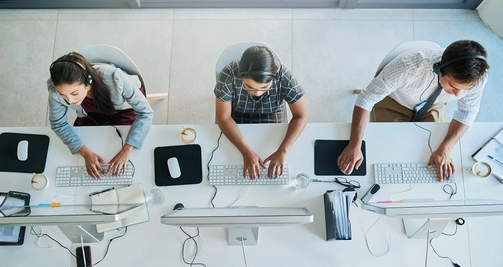 high angle shot of a team of call center agents working in an office