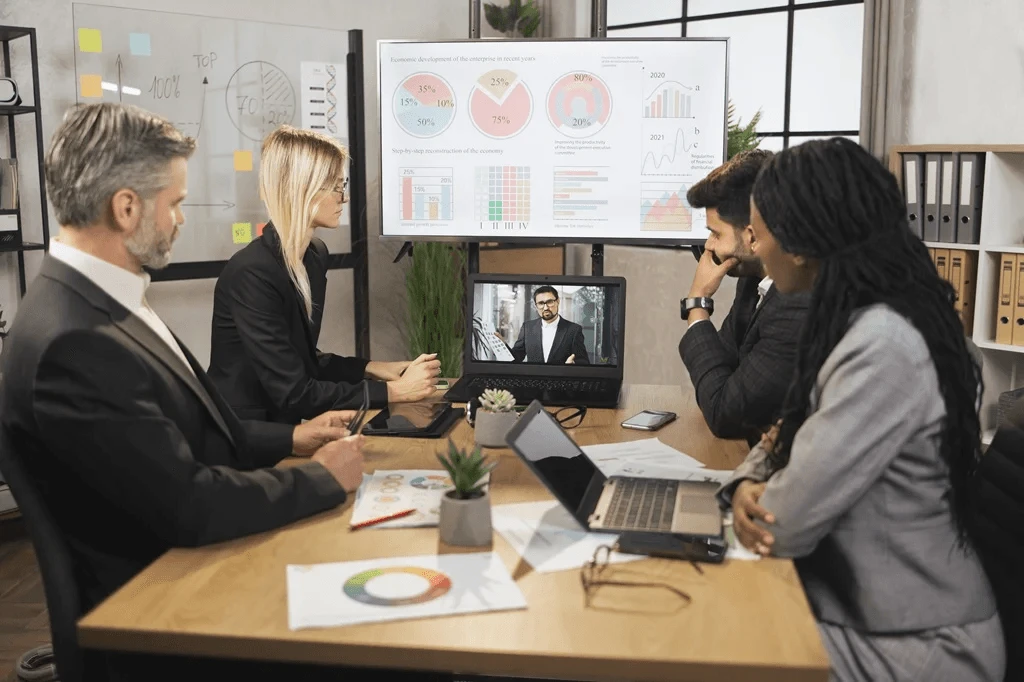 executives having a virtual discussion with an outsourcing partner