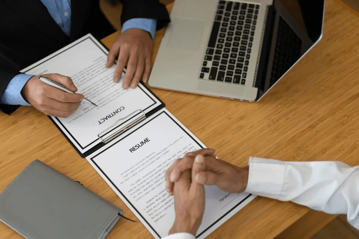 hiring manager presenting an employment contract after an interview