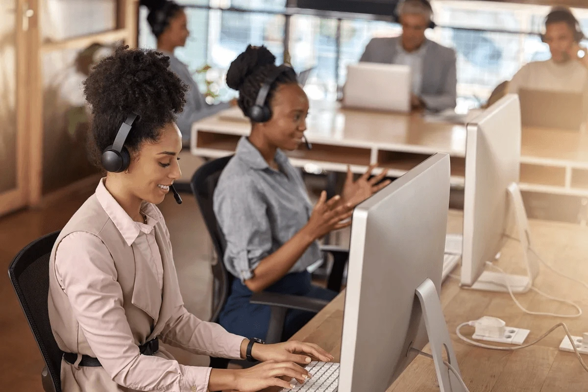 call center agents assisting customers at their desks