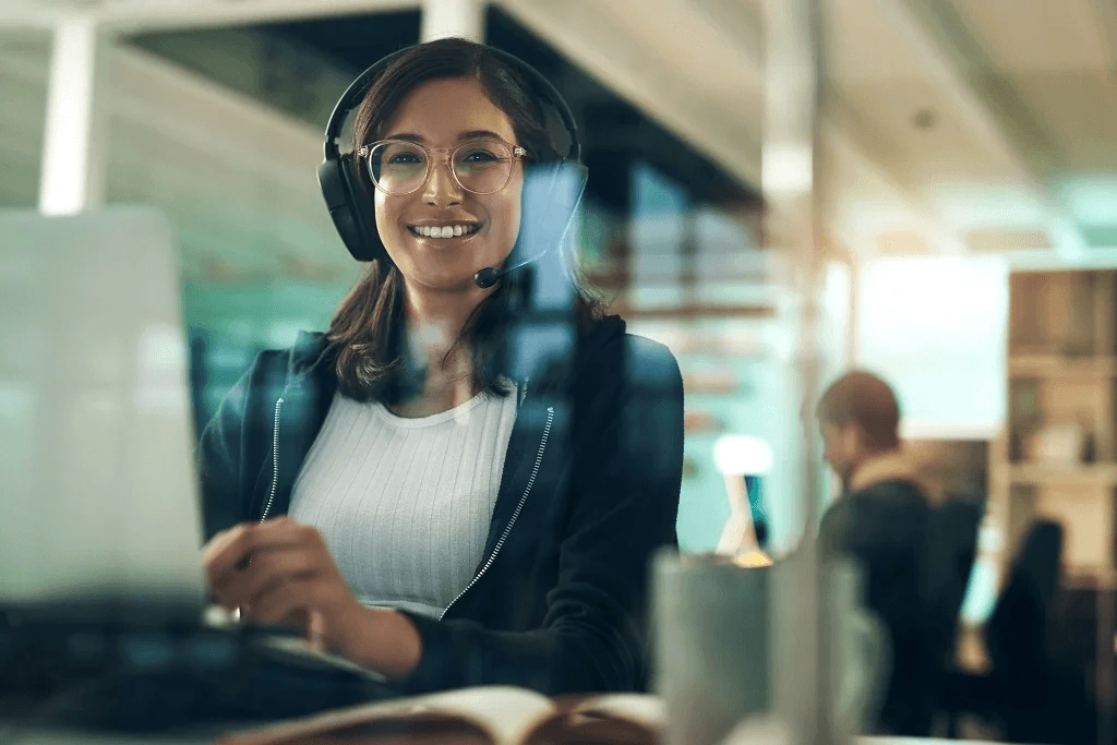 woman happily using cloud based application in work