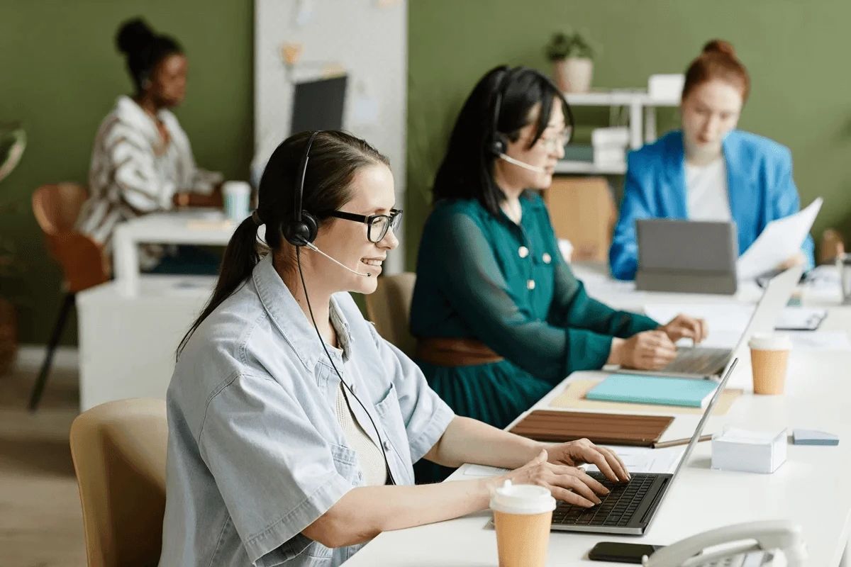 busy call center agents handling customer calls