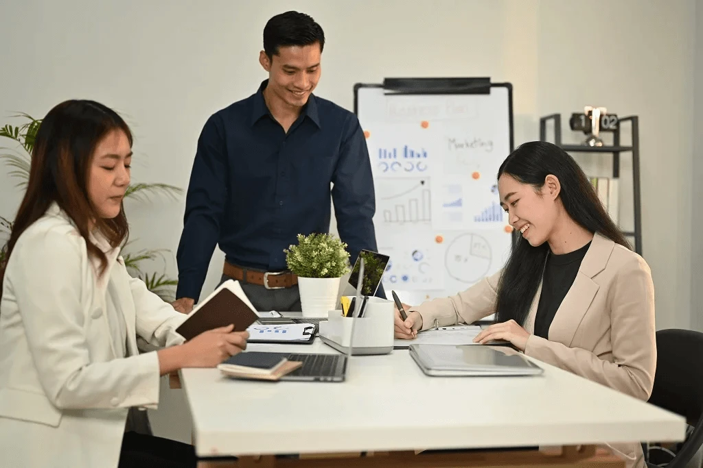 employees strategizing how to promote outsource work to philippines