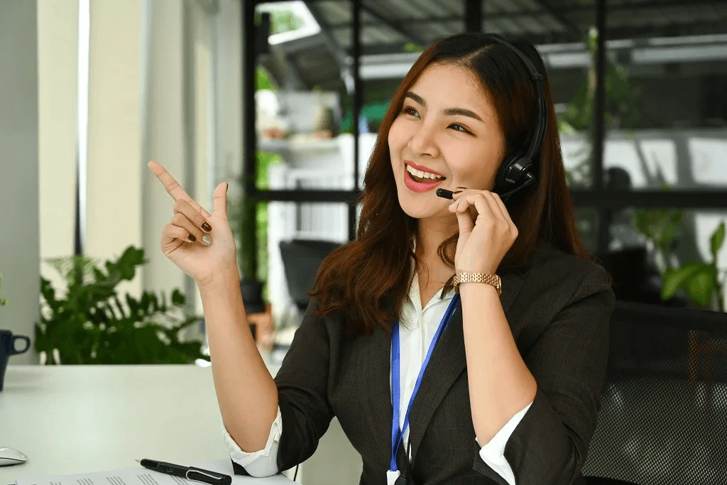 inspired female employee happily committed to taking calls