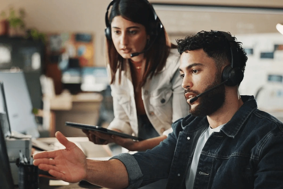 IT support team assisting each other for tasks delegation