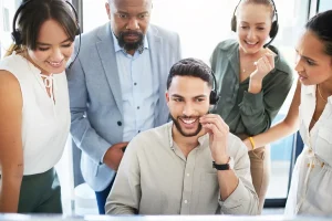 BPO employees having a team huddle