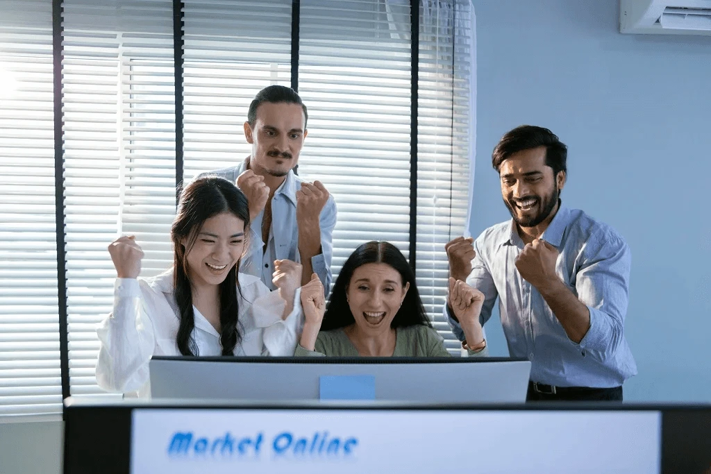 digital marketing team celebrating their online market ranking