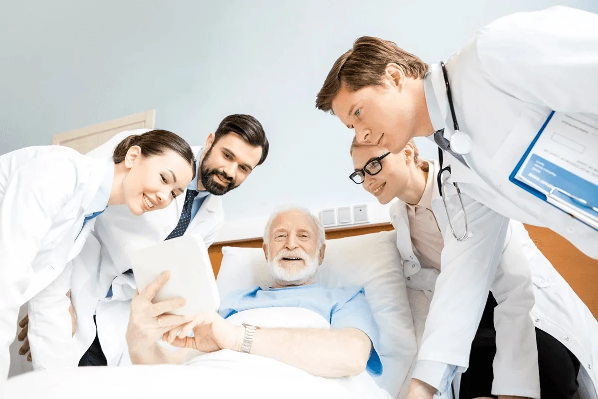 hospital staff surrounding a patient