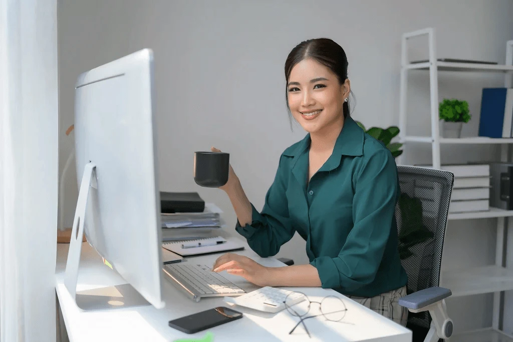 philippine virtual assistant drinking coffee while working