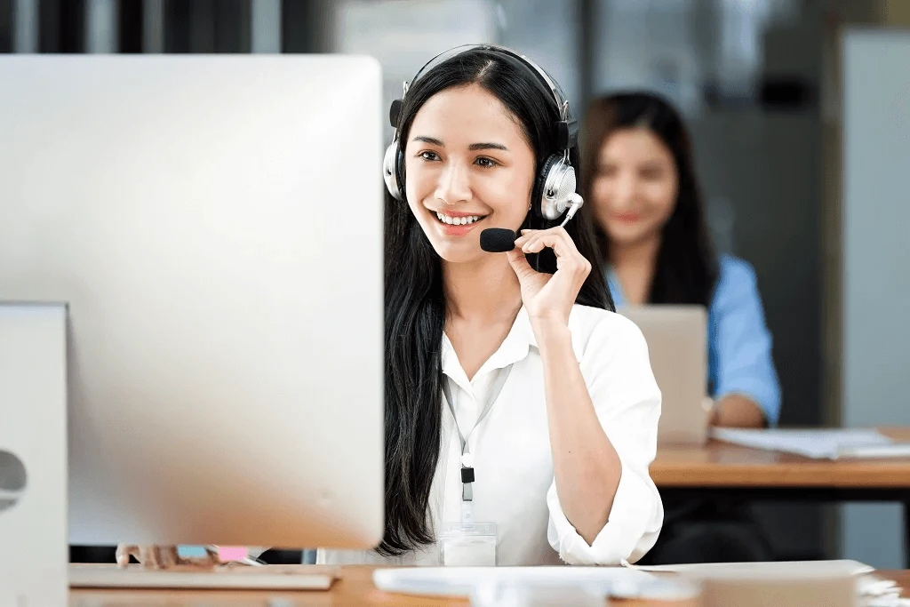 smiling customer support operating a call at work