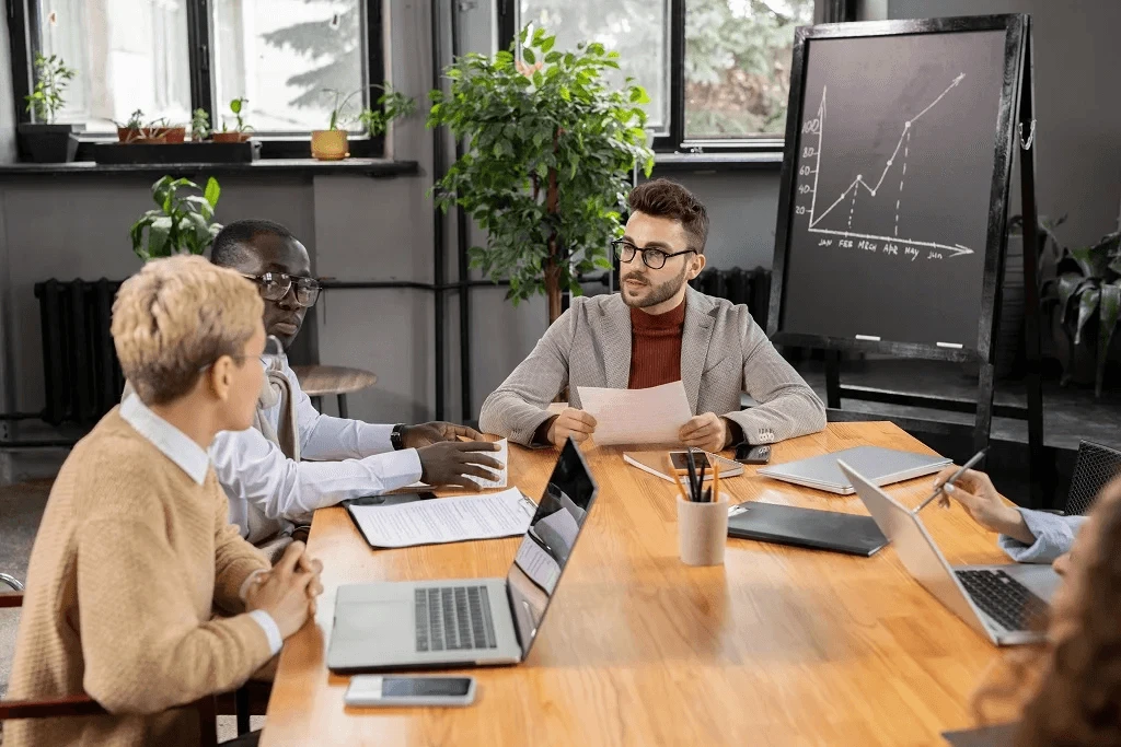 team of a startup scaling their business standing in the office