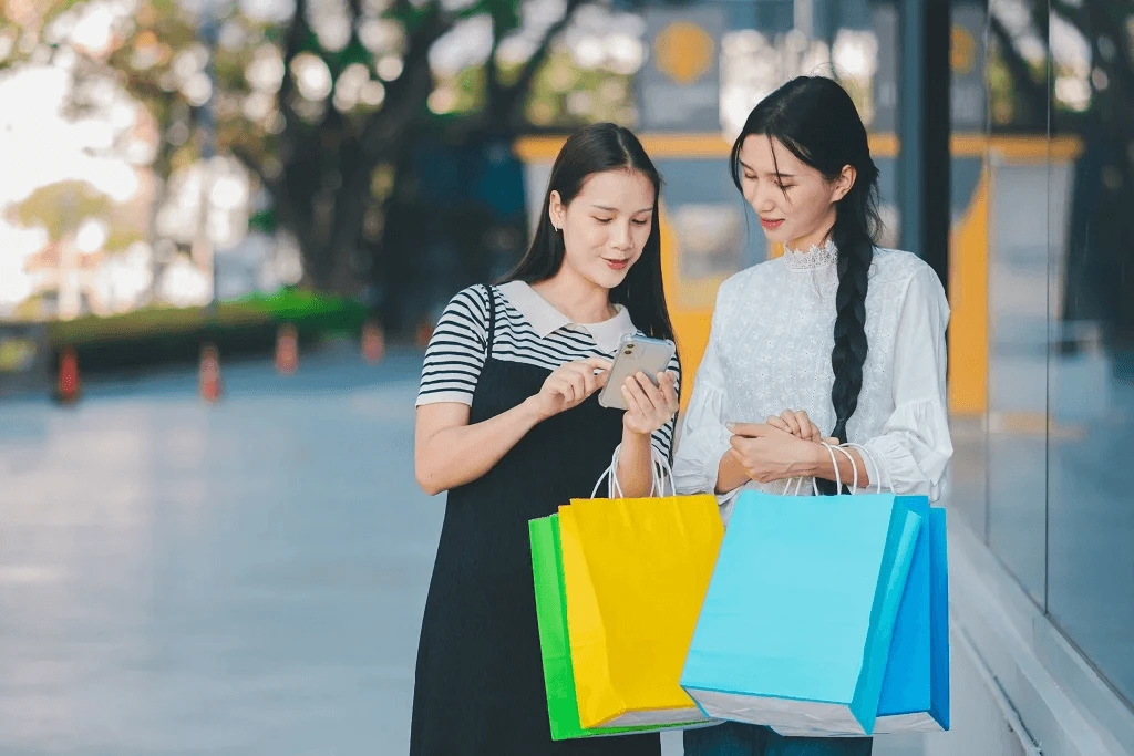 two female social media customer service are busy talking with the customer on black friday