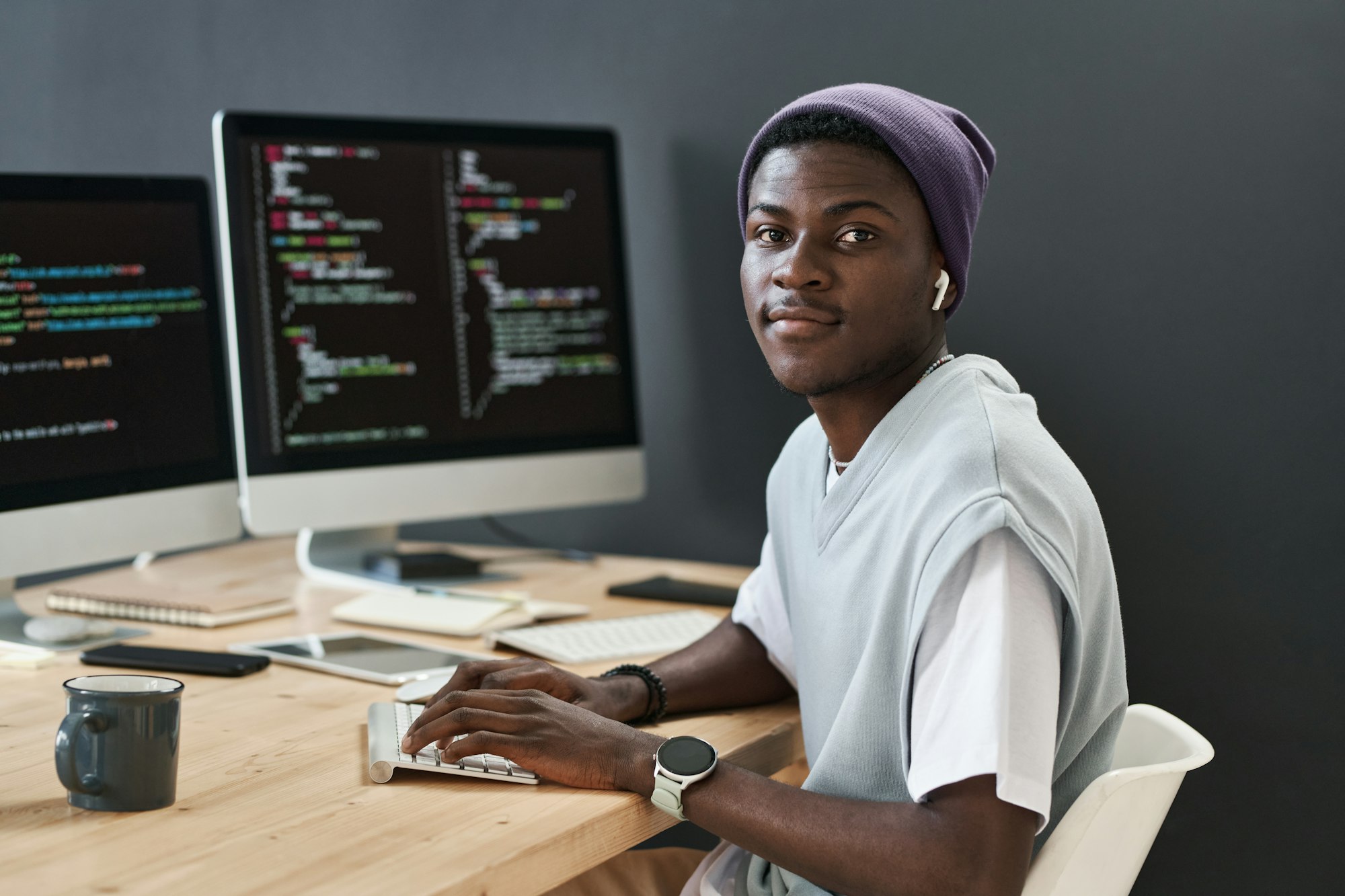 Young confident African American IT support manager looking at camera