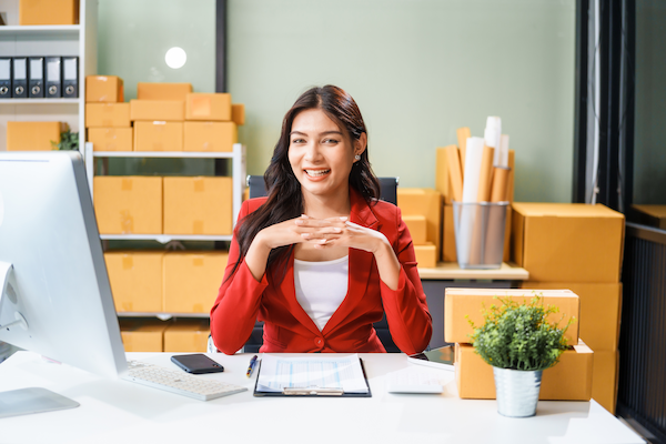 a beautiful businesswoman sits at table