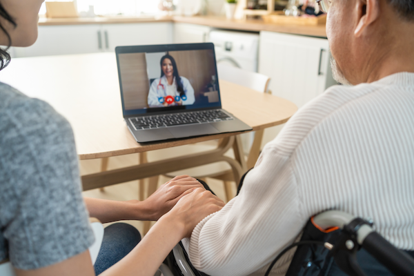 asian senior male and daughter video call