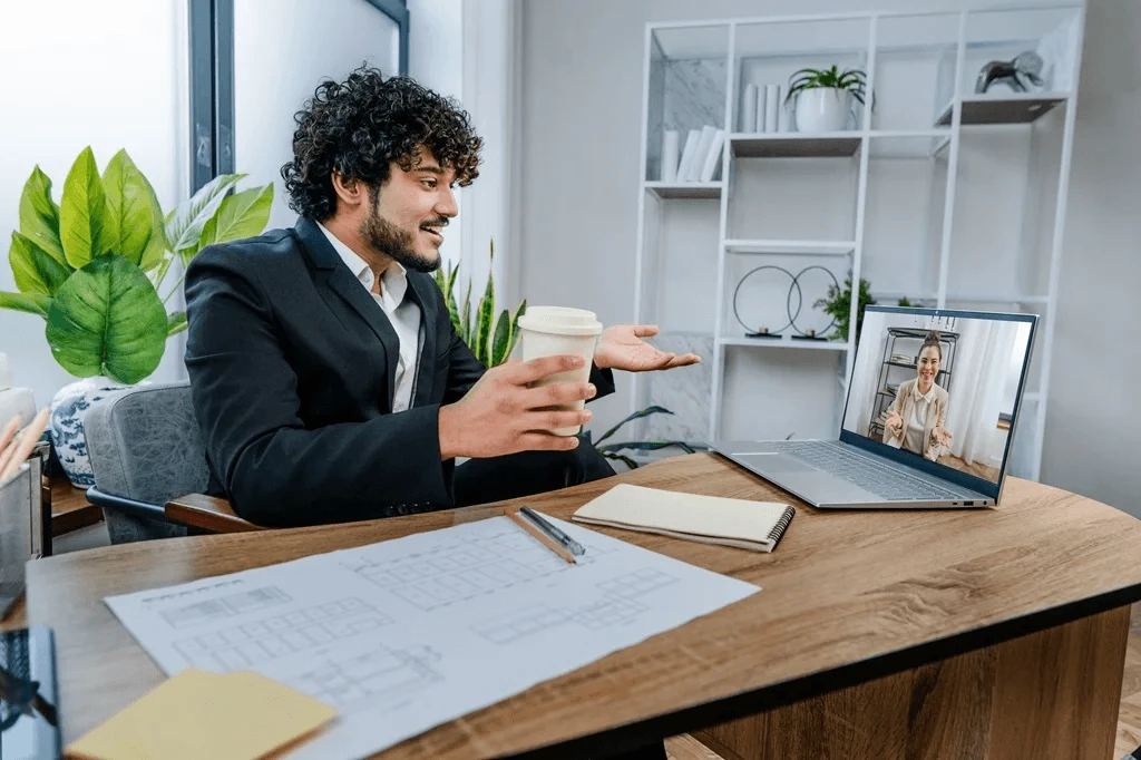 business coach having an online meeting with his hired virtual assistant