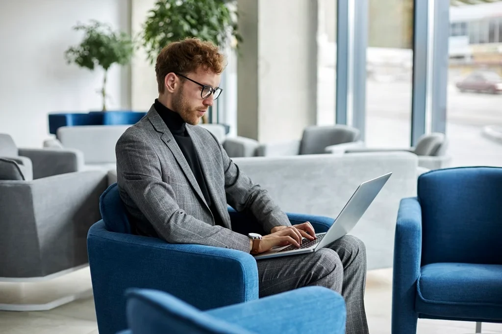 business executive contemplating the possibility of outsourcing customer service