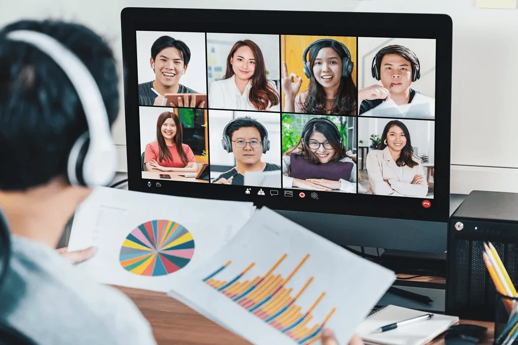 business owner meeting virtually with his outsourced customer service team