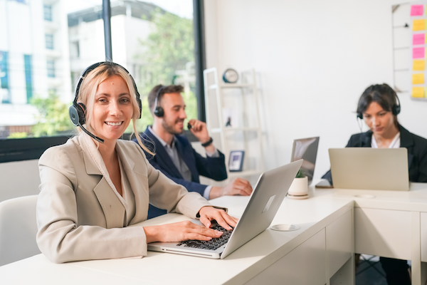 charming business lady in headphones talking