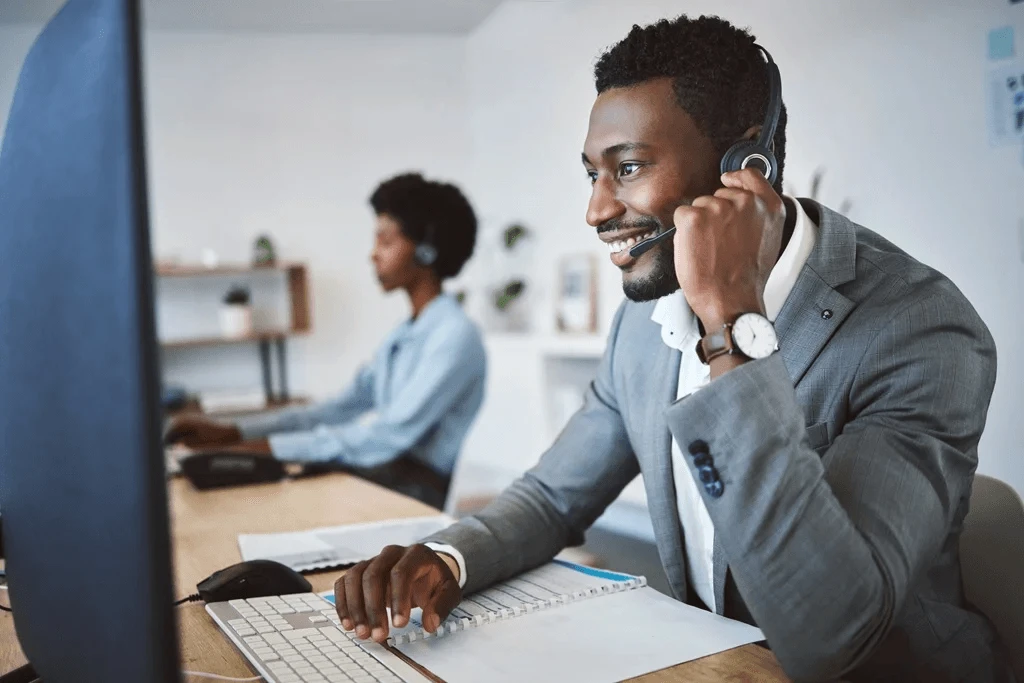 customer service agent in front of his computer