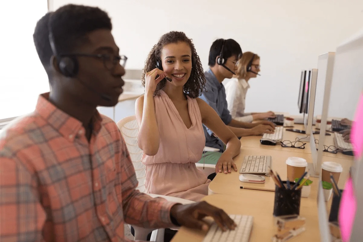 customer service outsourcing team in their work stations