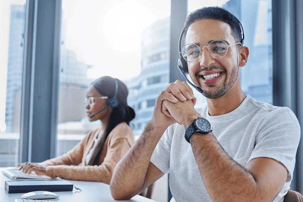 enthusiastic customer service agents at their workstations