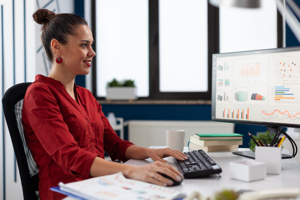 entrepreneur looking at charts on computer