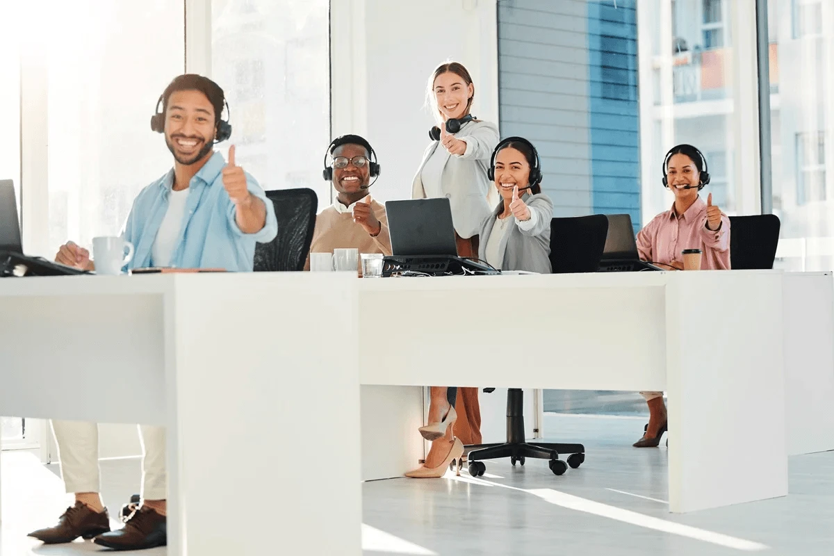 happy BPO employees in their workstations