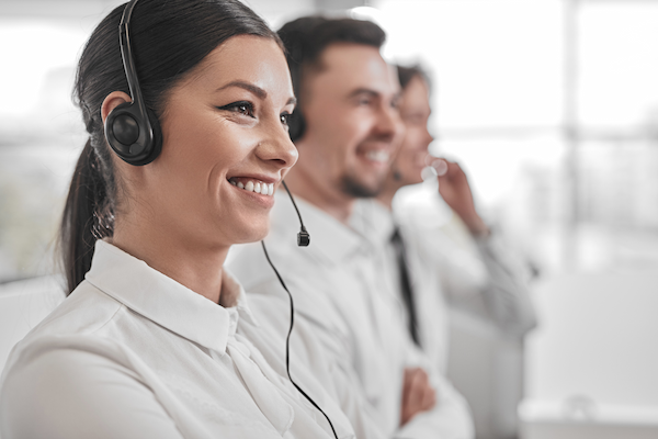 happy woman working in help line team