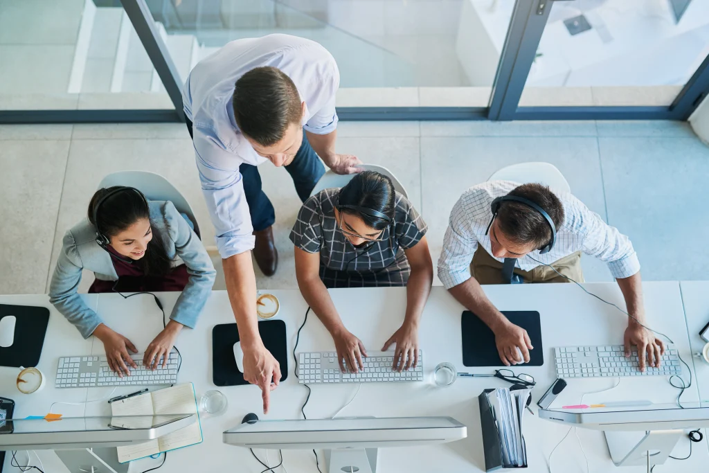 high angle shot of a man assisting his colleagues